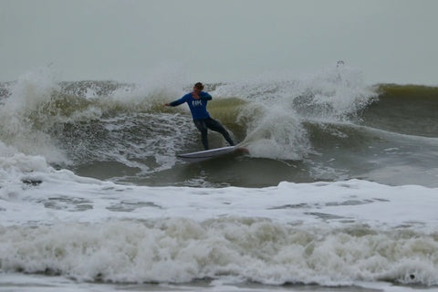 koen surfing the wave on his board