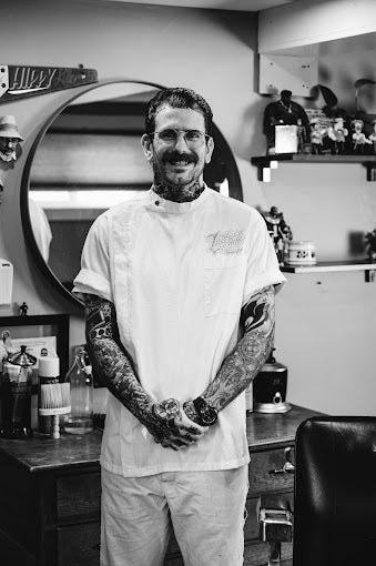 A portrait of Jeremy, the lead barber of Left Side Barbershop