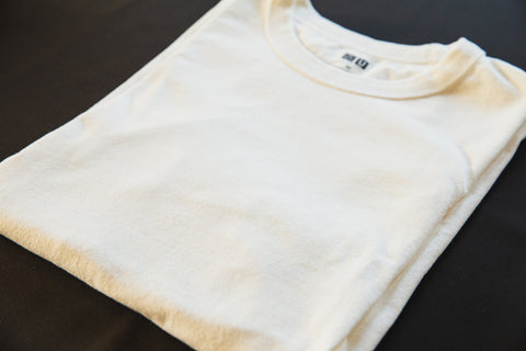 A white cotton t-shirt folded up