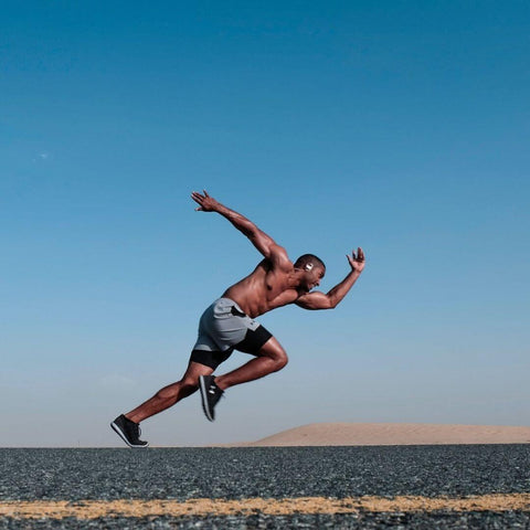 a person running on the street with CBD for energy