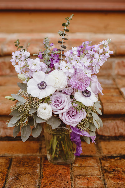 purple and lavender centerpiece for a spring wedding