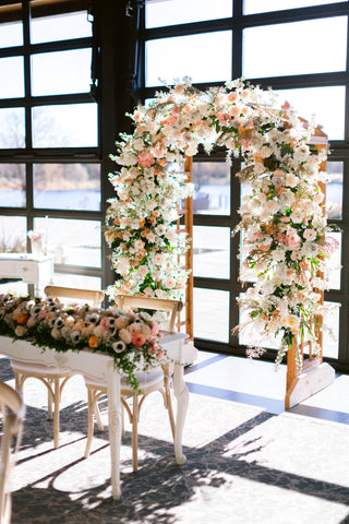 Flower Forecast: 2023 Wedding Trends full flower arch in unique place
