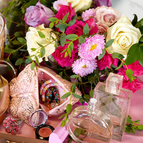 Barbiecore Wedding Inspiration flat lay with Barbie inspired items. What would Barbie's vanity look like?