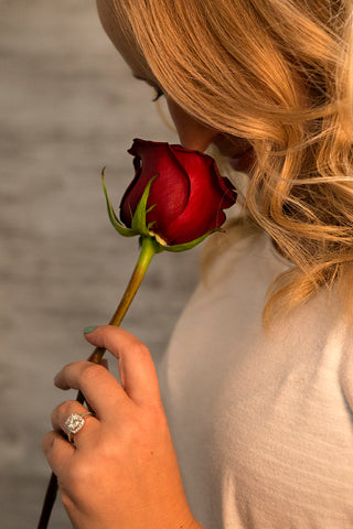 5 Reasons to Choose Roses engage woman smelling a red rose