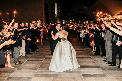 bride and groom kissing during their sparkler send off