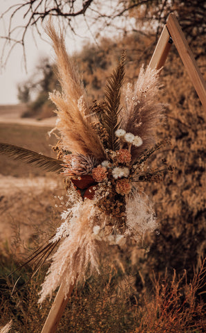 boho wedding wedding arch close up on the flowers