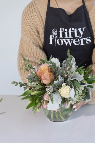 FiftyFlowers employee following flower care steps before a wedding