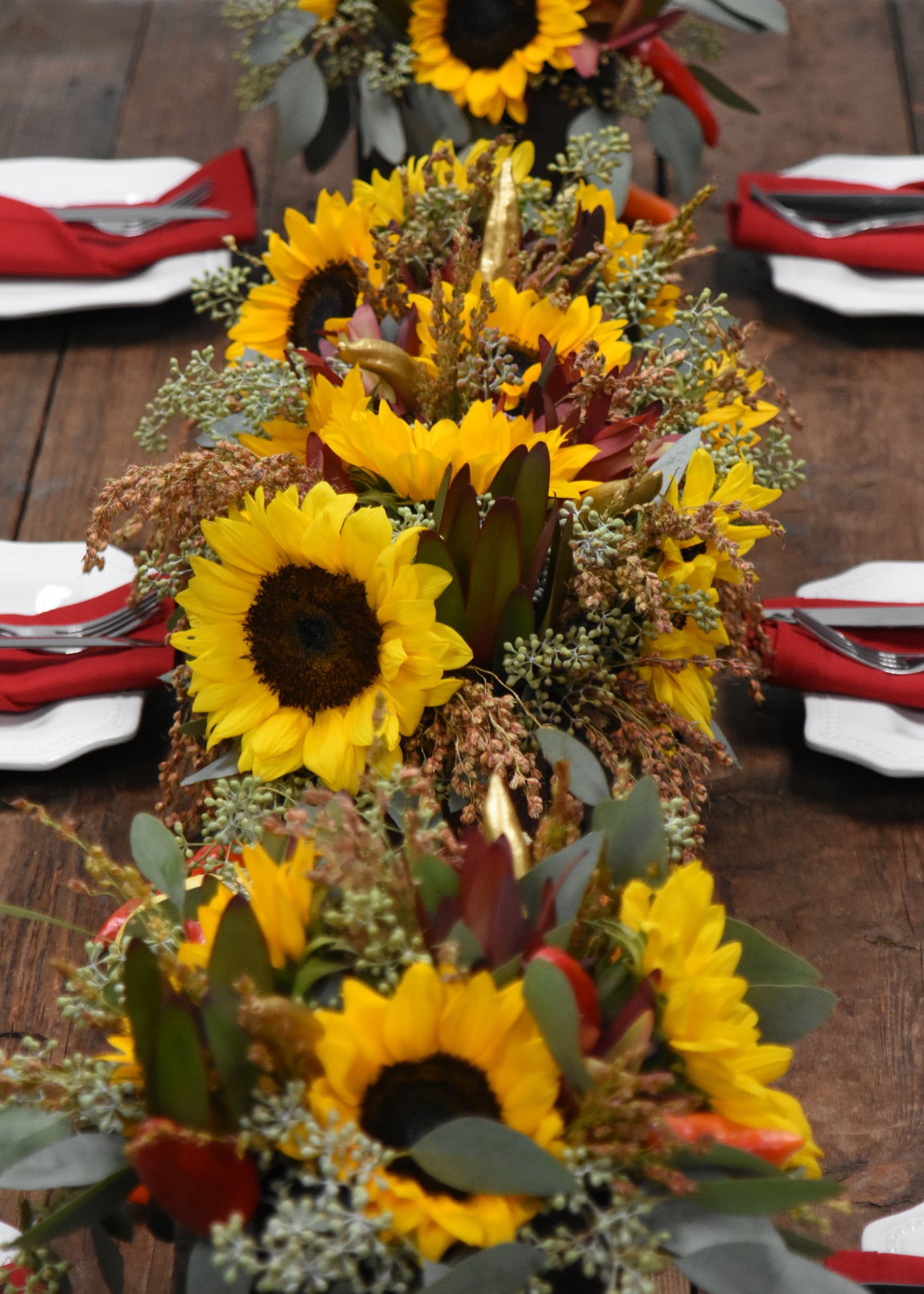 yellow sunflower arrangement table centerpiece with greenery