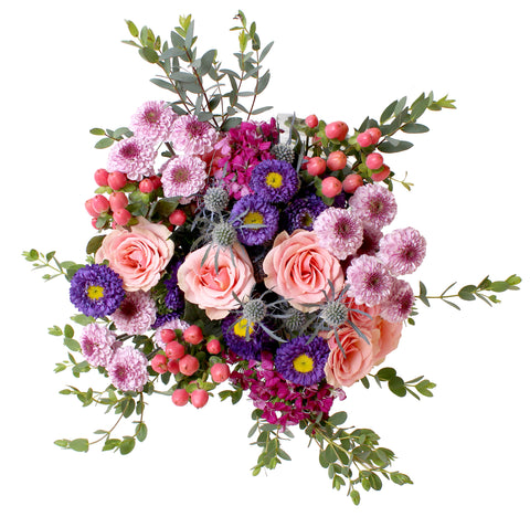 pink and purple centerpiece with asters, roses, and hypericum berries