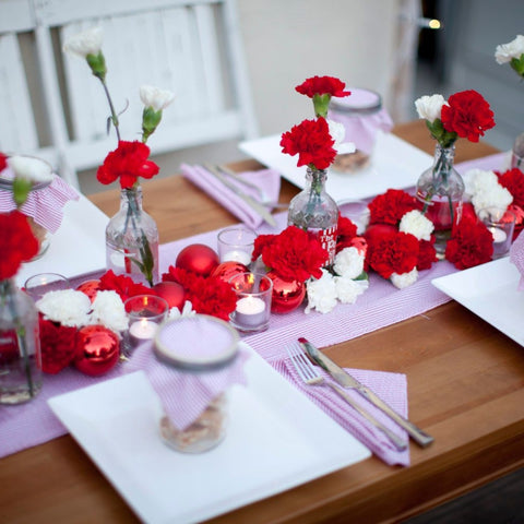 Get Festive This Season with Holiday Flowers place settings with flowers