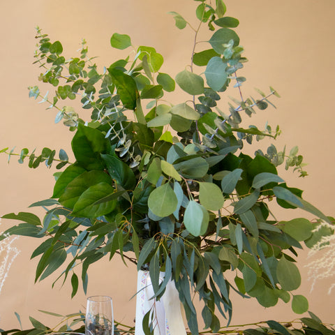 greenery bouquet in a white vase