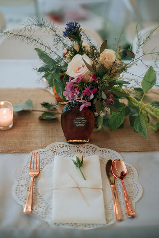 FiftyFlowers How To Style Toffee Roses and Possible Alternatives rustic wedding tablescape with rustic centerpiece containing toffee roses and toffee rose alternatives