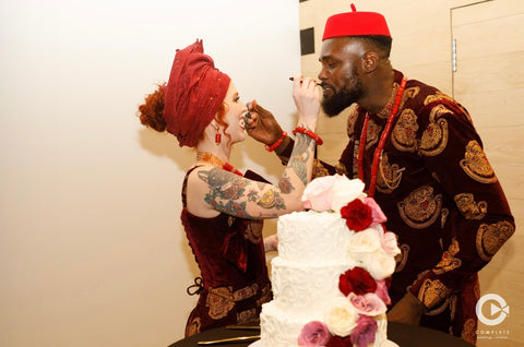 bride and groom feeding each other cake