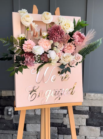 pink themed 3D flower sign with pink sign and pink flowers coming out of it
