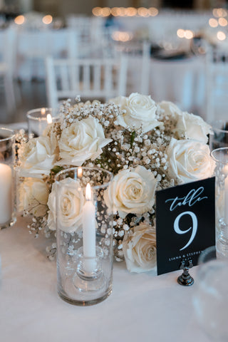 White rose and white baby's breath table centerpiece