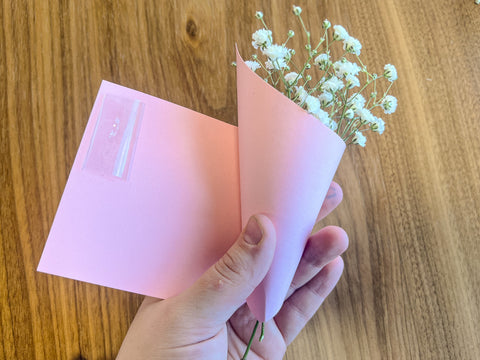 wrapping pink paper around mini baby's breath