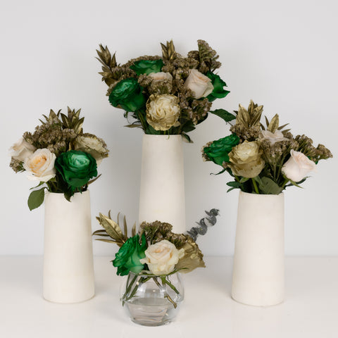lucky charm flower centerpieces in four vases with all four sizes