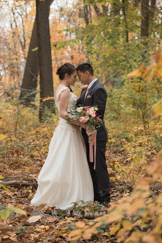 bride and groom in the forest on their wedding day