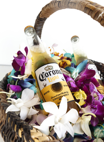 alcoholic beverage in a basket with orchid petals