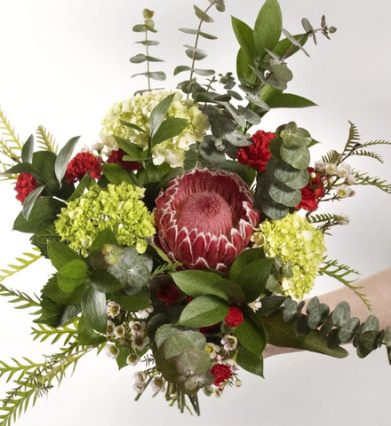Bouquet with a protea flower.