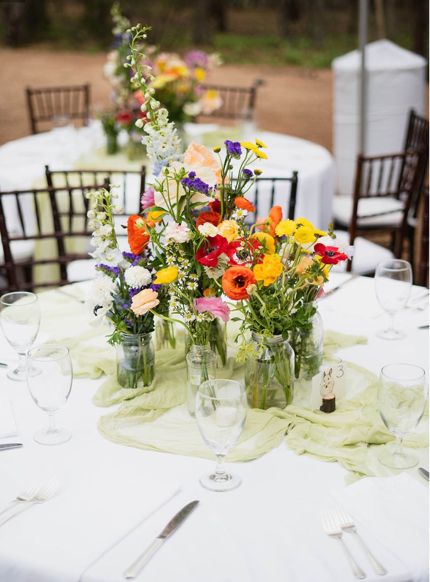 These bright wedding centerpieces are easy to DIY using jars and small vases