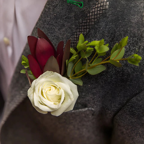 Boutonnière in grooms jacket pocket.