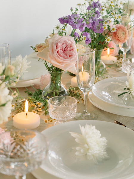 tea light candles with pink purple and orange flowers for a table centerpiece