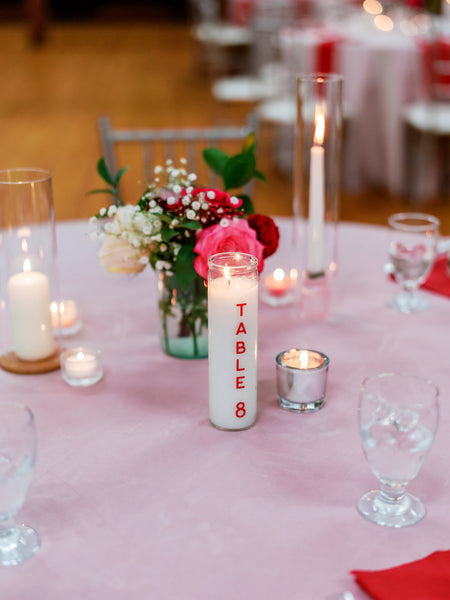 candle used as table number for centerpiece at wedding