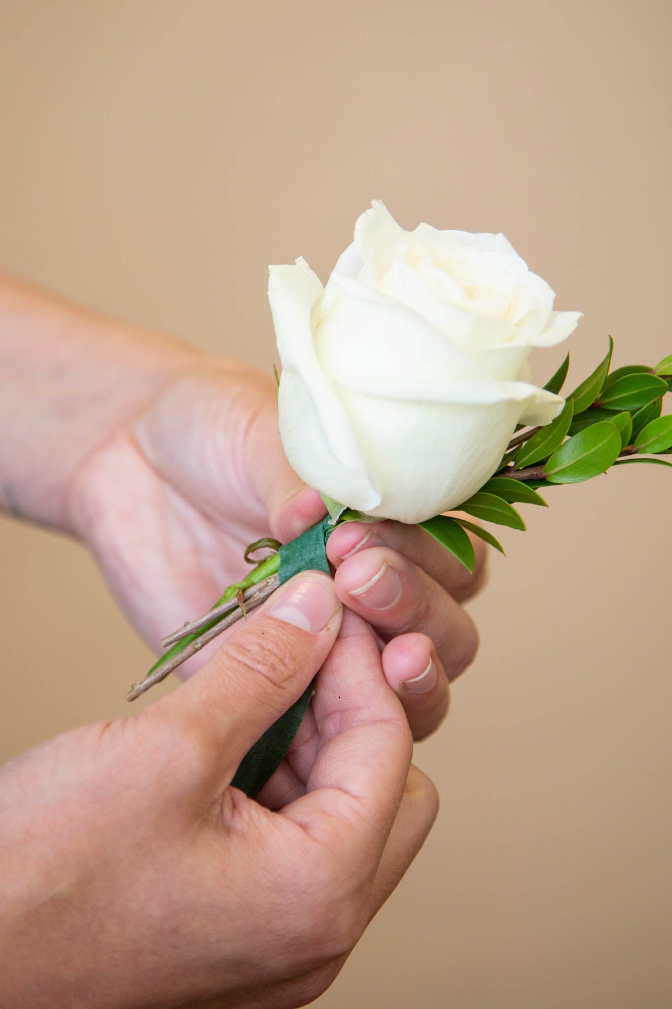 How to Make a Corsage, Step 5: Start with Focal Flower and Greenery