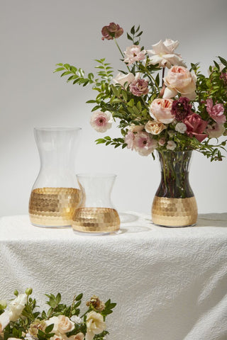 three geometric vases with glass and metallic bottoms