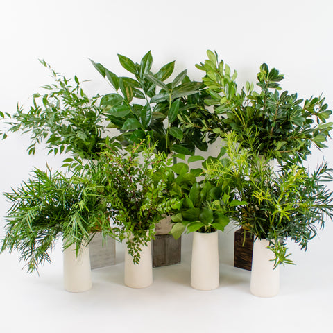 eight greenery bunches in vases