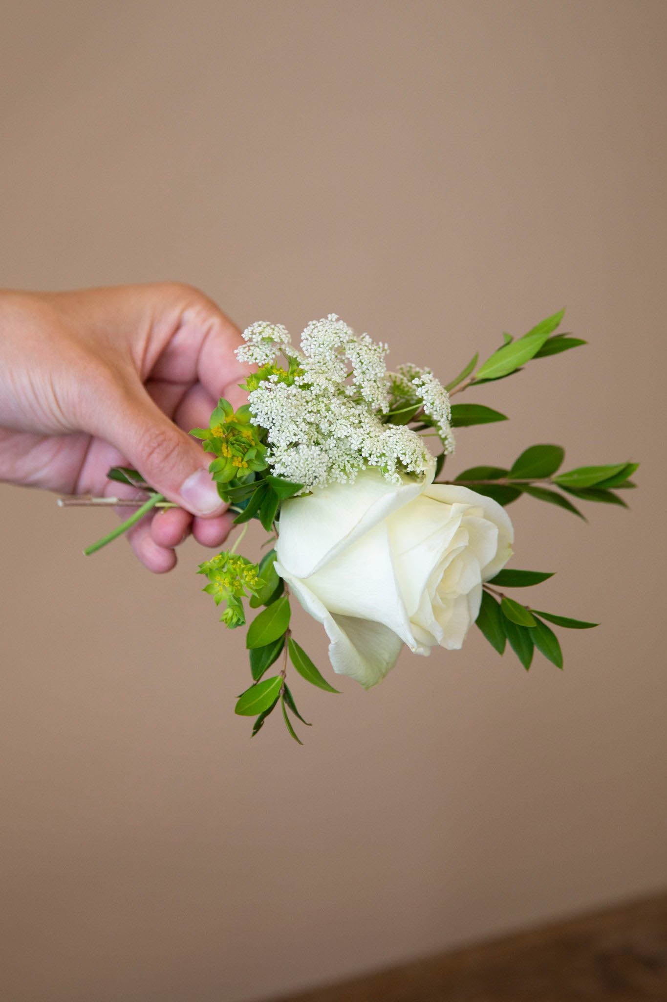 Add filler flower to your boutonniere design