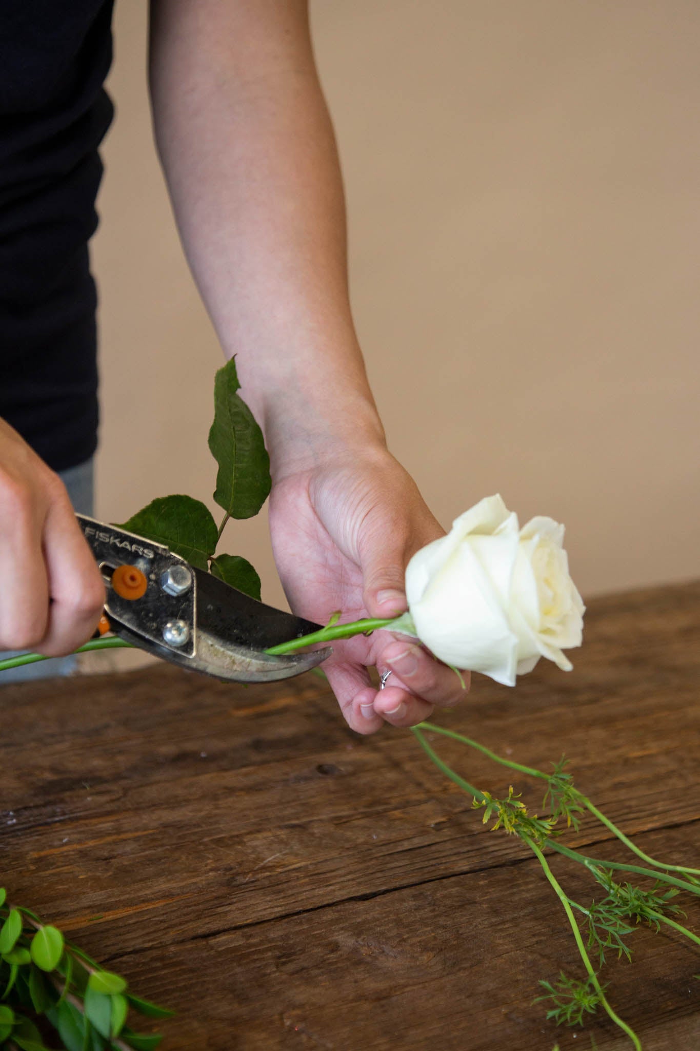 Trim the stems of your flowers down to 1.5 inches for your DIY boutonniere