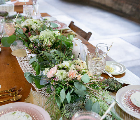 tablescape with sage green and light pink flower garland