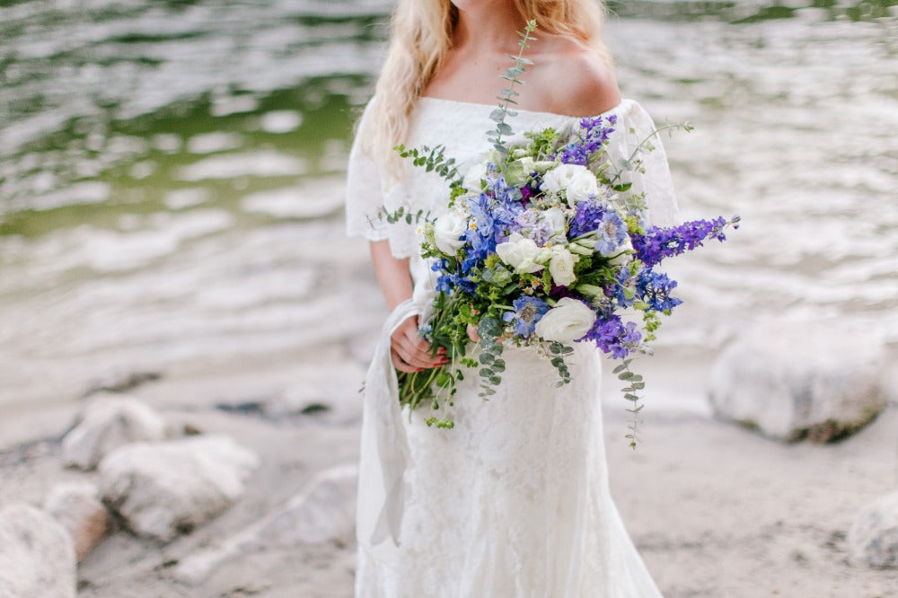 popular type of wedding bouquet with overflowing purple and white flowers