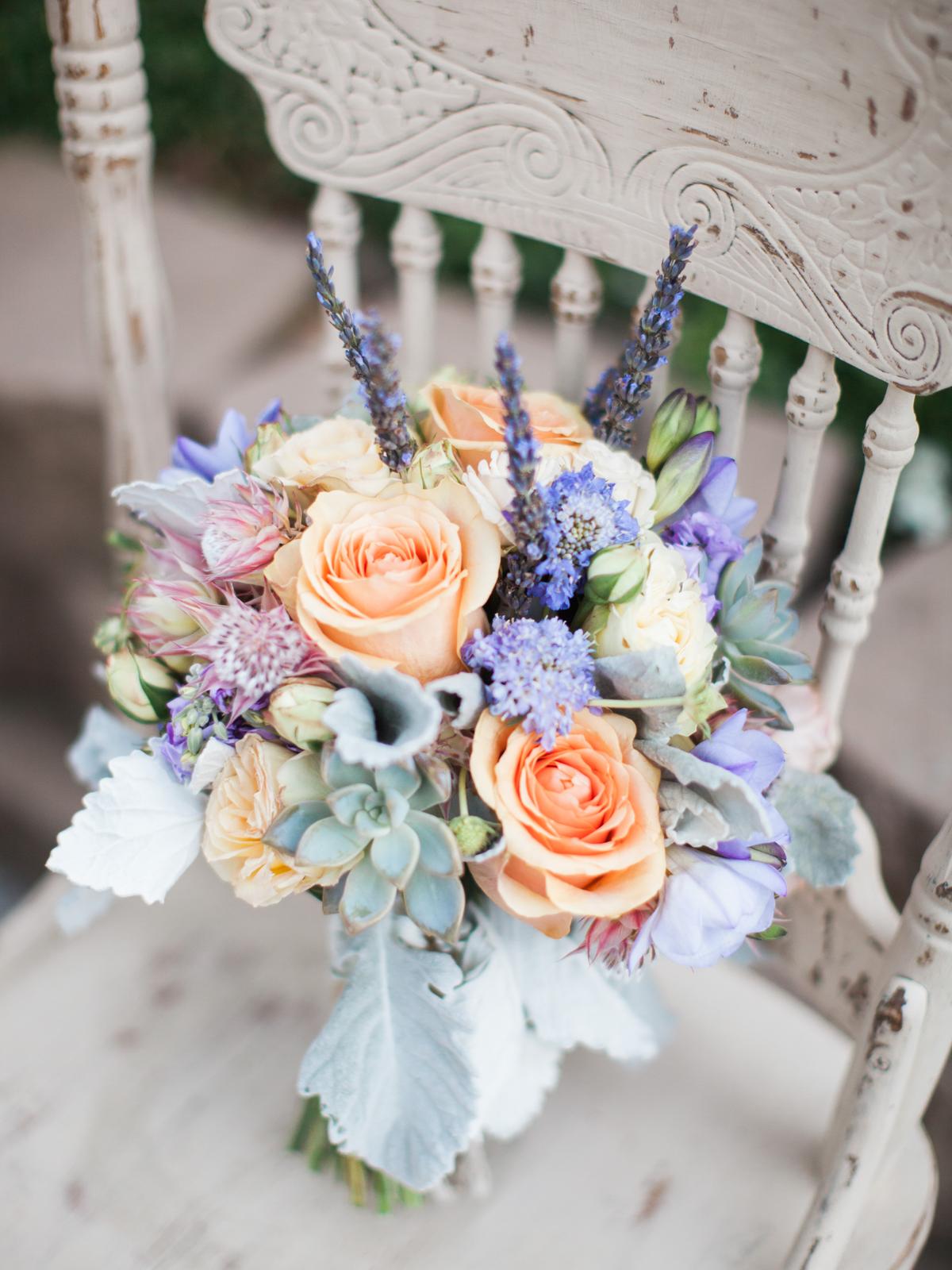 peach and periwinkle wedding bouquet with succulents