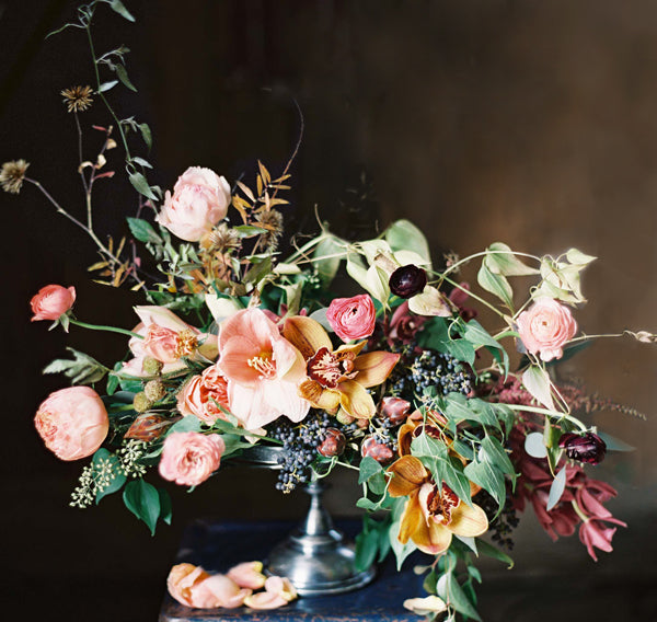 orange, pink, and green winter wedding centerpiece