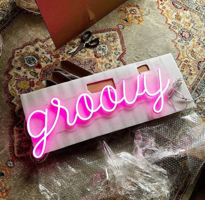 "Elevate your space with our vibrant pink 'Groovy' LED neon sign. A retro-inspired masterpiece that radiates positivity. Perfect for home decor or events. Get groovin' and order yours today!"