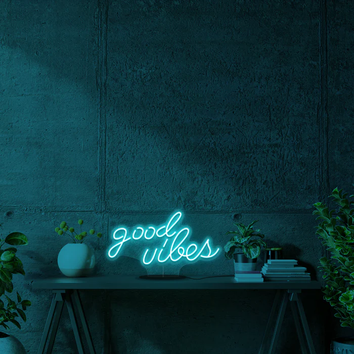 "Shop our stunning blue 'Good Vibes' LED neon sign. Illuminate your space with positivity and style. Perfect for home decor, events, or gifts. Get yours today!"