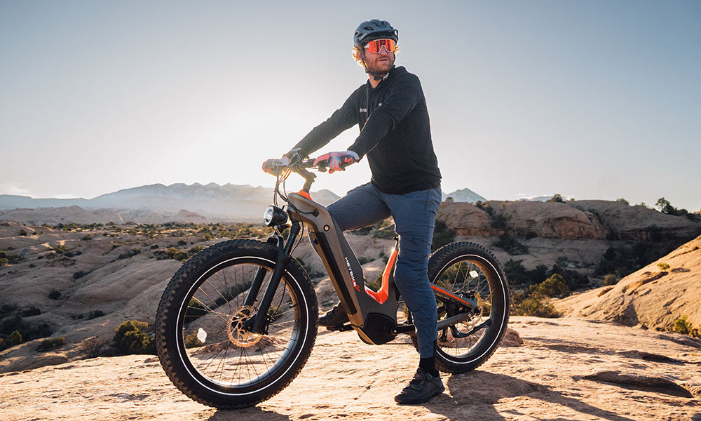 a man is riding Hero mid-drive ebike