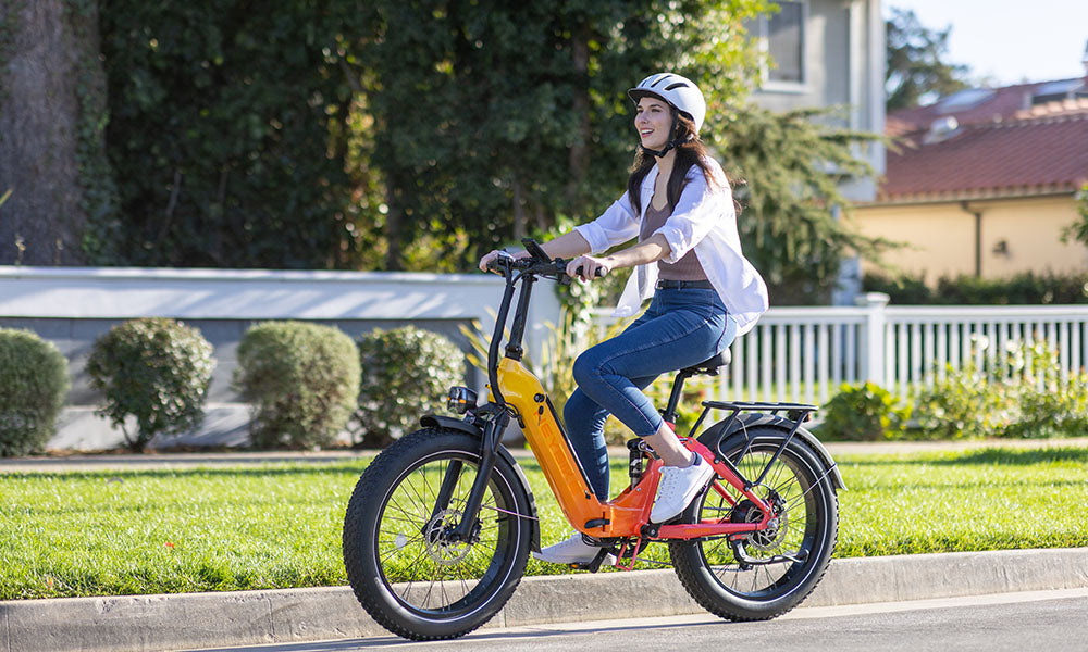 a womam is riding horizon ebike on the road