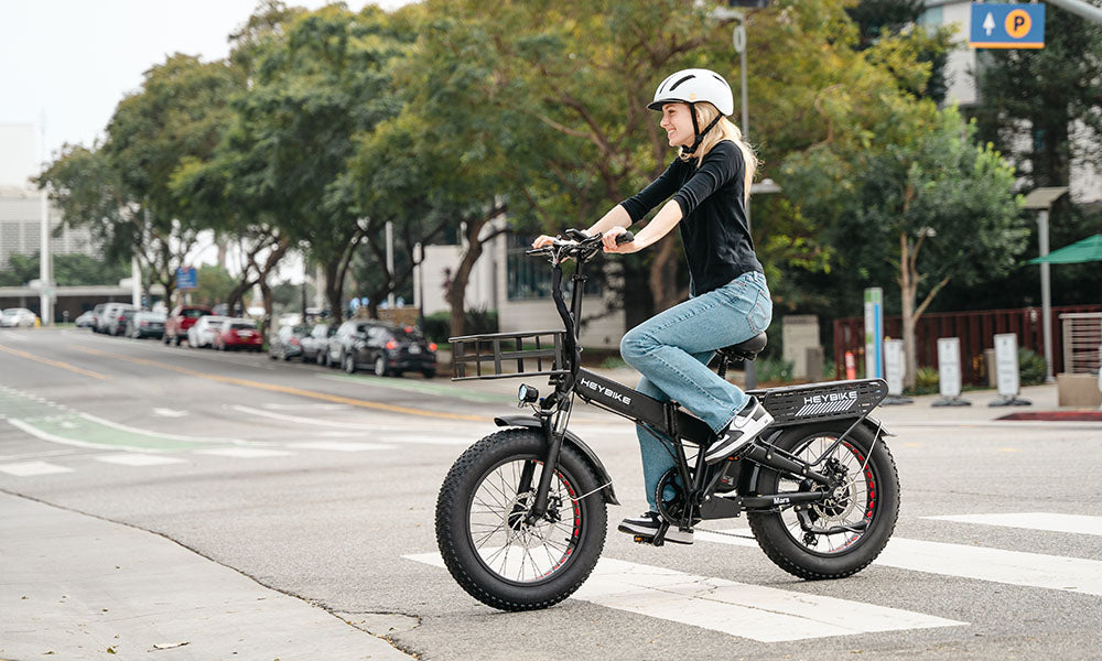 A girl is riding a Mars 2.0 e-bike with a 1000-watt motor