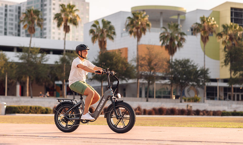 a man is riding Ranger S folding fat tire ebike with 20-inch wheel