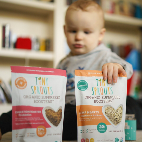 Austin reaching for Tiny Sprouts Hemp Hearts