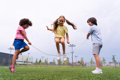 Kids playing jumprope on a summer day