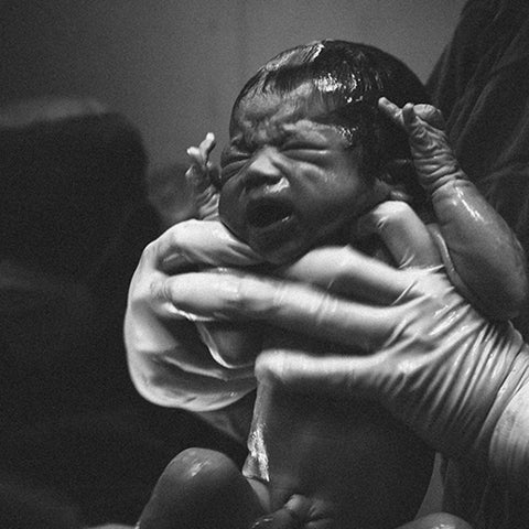 newborn baby in hospital black and white image