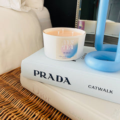 Scented Candle with Lex Pott 54 Celsius Candle Prada Book Dior Book Wicker Basket Mirror Bedroom Setting