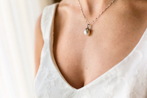 woman wearing a real pearl necklace for her wedding