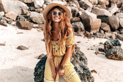 Woman in a yellow boho vintage 70s outfit