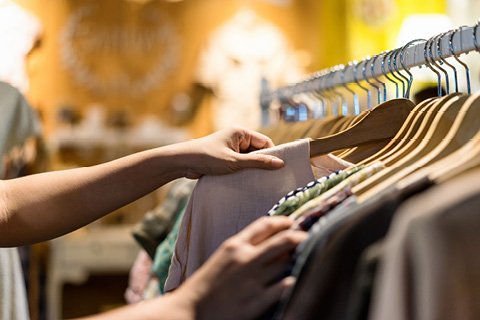 Woman shopping for graphic t-shirt